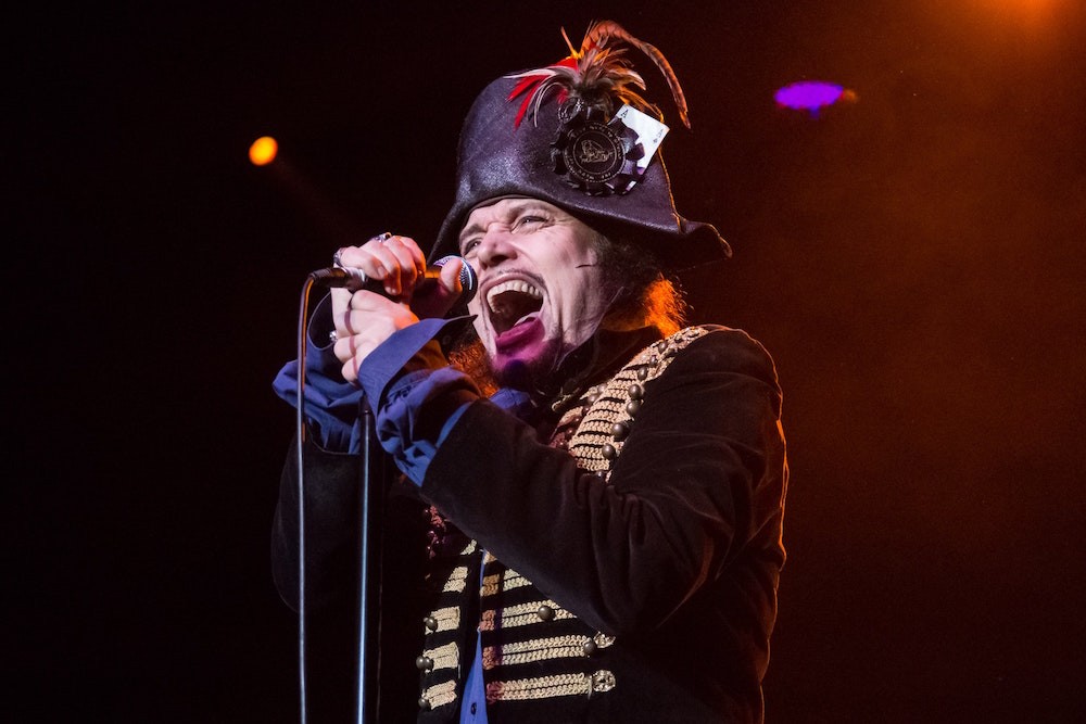 Adam Ant stands, delivers