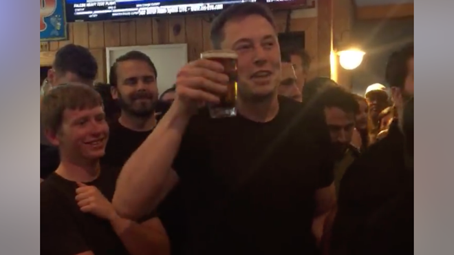 Here's Elon Musk drinking a beer at a bar in Port Canaveral after the SpaceX Falcon Heavy launch