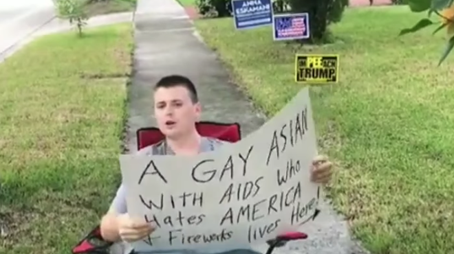 Trump supporter and local asshole holds homophobic sign outside of Orlando man's home (3)