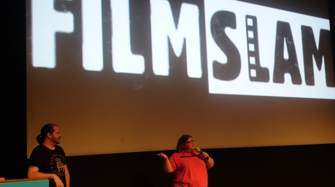 Jen Vargas addresses the FilmSlam crowd after being introduced by outgoing director and host Tim Anderson.