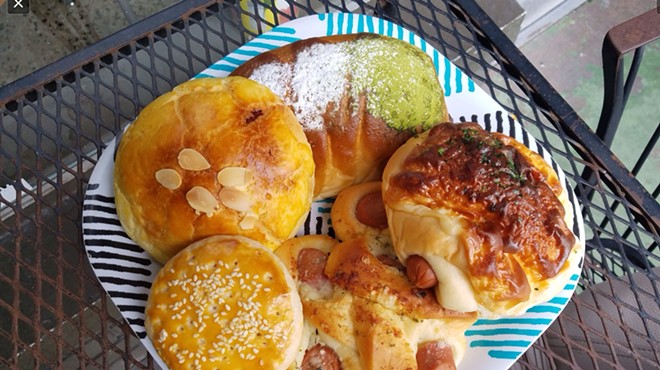 Clockwise from top: Matcha bun, cheese and hot dog bun, garlic and hot dog bun, Sweetheart cookie, pineapple taro bun