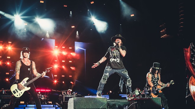 Duff, Axl, and Slash on stage together (!) at Camping World Stadium in Orlando.