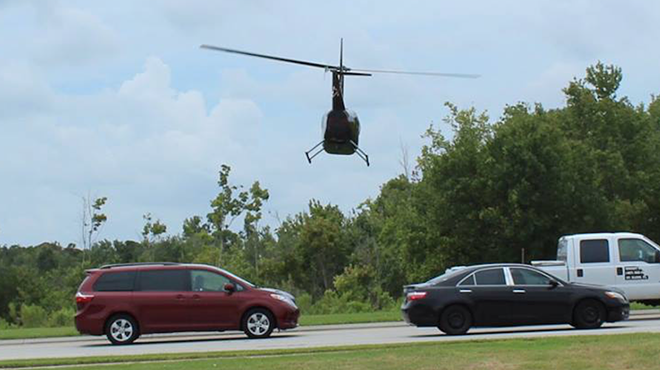 Local pilot arrested for flying tour helicopter within a few feet of cars