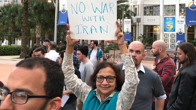All the best signs from Orlando's 'No War with Iran' protest