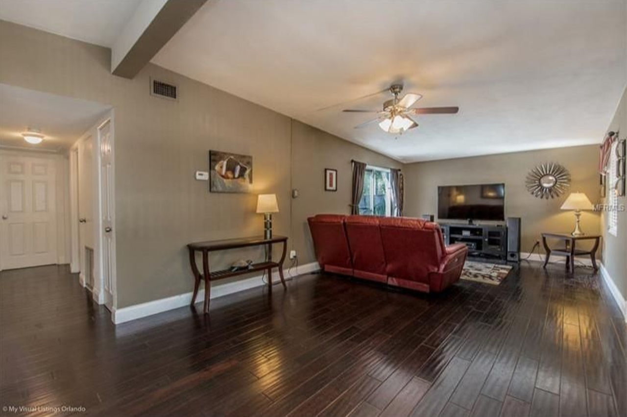 902 Crestwood Lane, Altamonte Springs
$149,800
3 beds, 1 bath, 1,076 sq ft, 8,812 sq ft lot
The spacious living room is well-adorned with dark wood flooring.