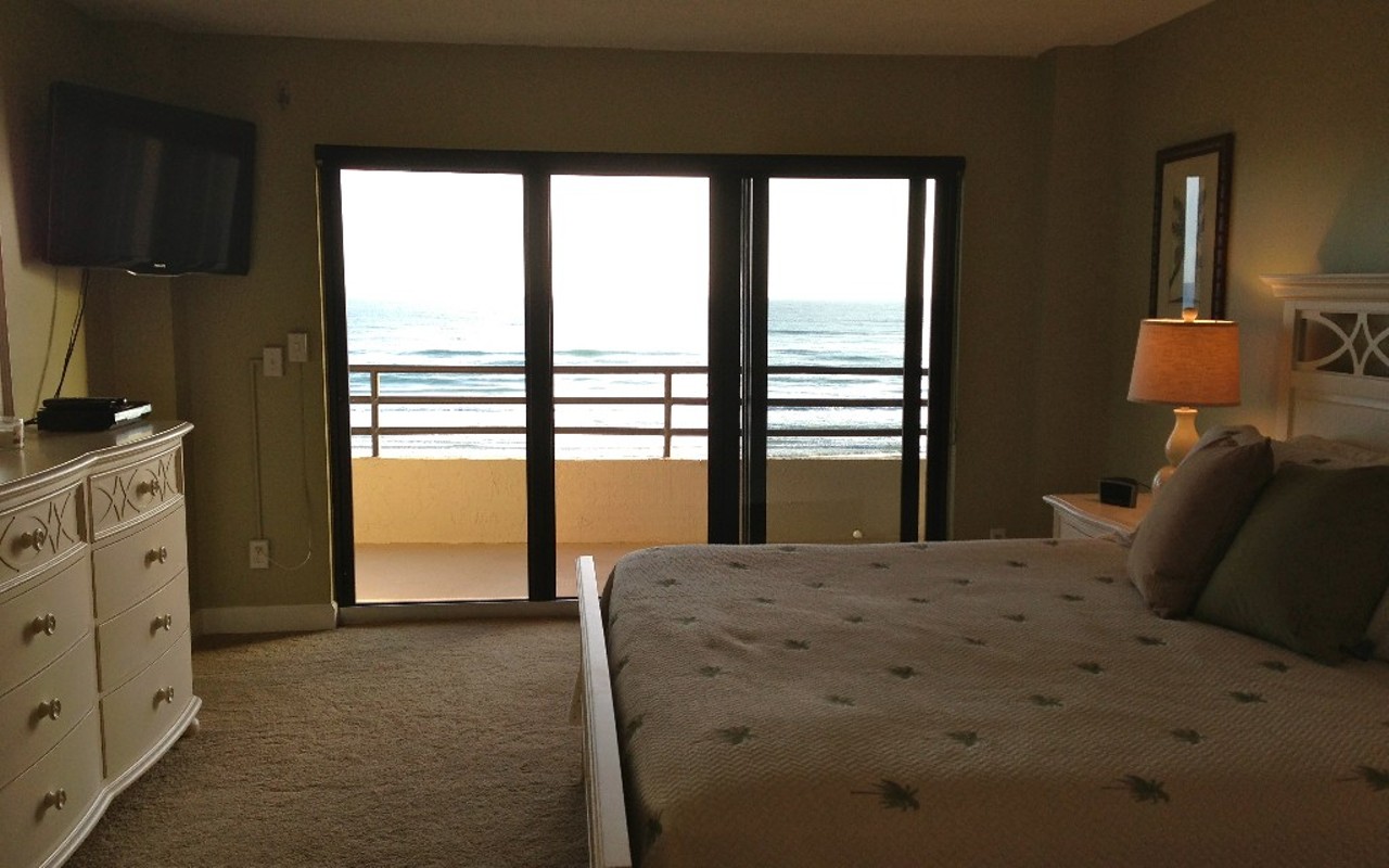  Stay at this three-bedroom beachfront condo in Daytona
Average night $95 
3 bedrooms
Bedroom has a view that leads right out to the water. Or the television. Your call.