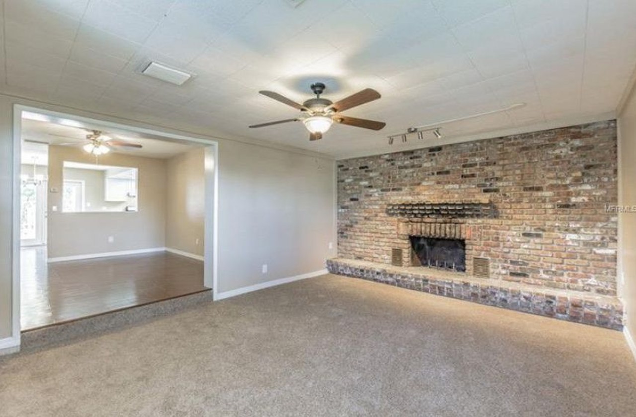 105 Lochinvar Dr, Fern Park
4 beds, 3 baths, 1,847, sq ft,  $261,900
Fresh carpet in this in this living room gives it a cozy feel next to this oversized fireplace area.