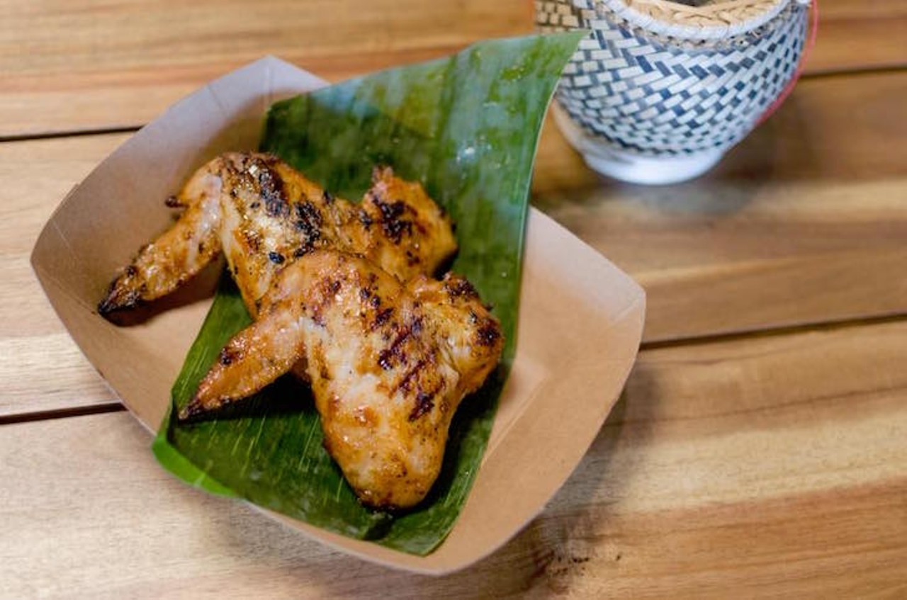 Try the grilled sticky rice chicken wings, best thing on the street. 
Photo via Sticky Rice Street Food via Facebook