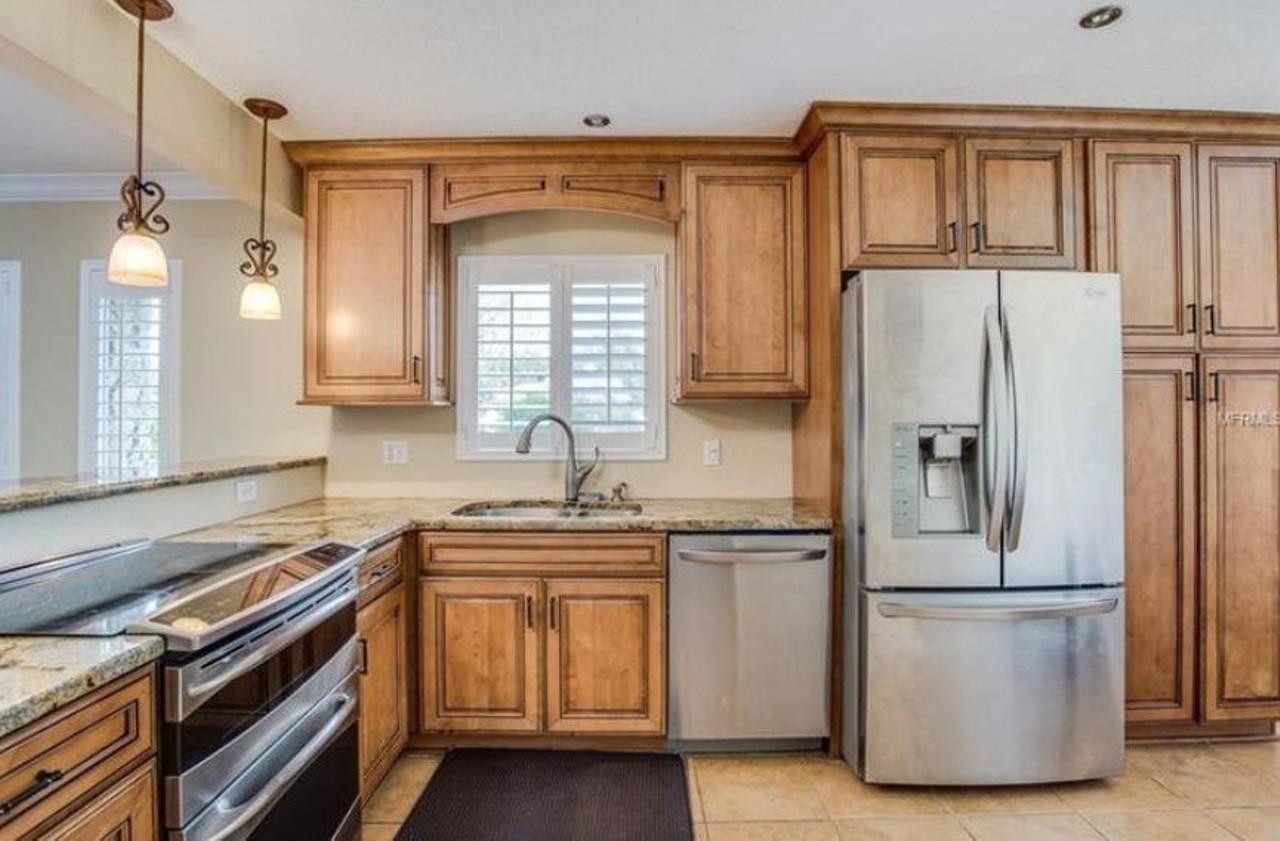 7334 Fieldcrest Ave, Winter Park
3 beds, 2 baths, 1,708 sq ft, 0.24 acres lot
$227,500, Est. Payment $857/mo
Who needs a kitchen makeover when your kitchen already looks like this? Enjoy new granite countertops and stainless steel appliances.
