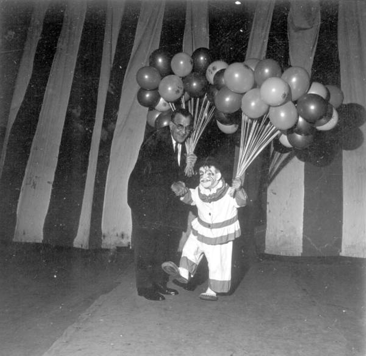 A small clown with balloons (via floridamemory.com)