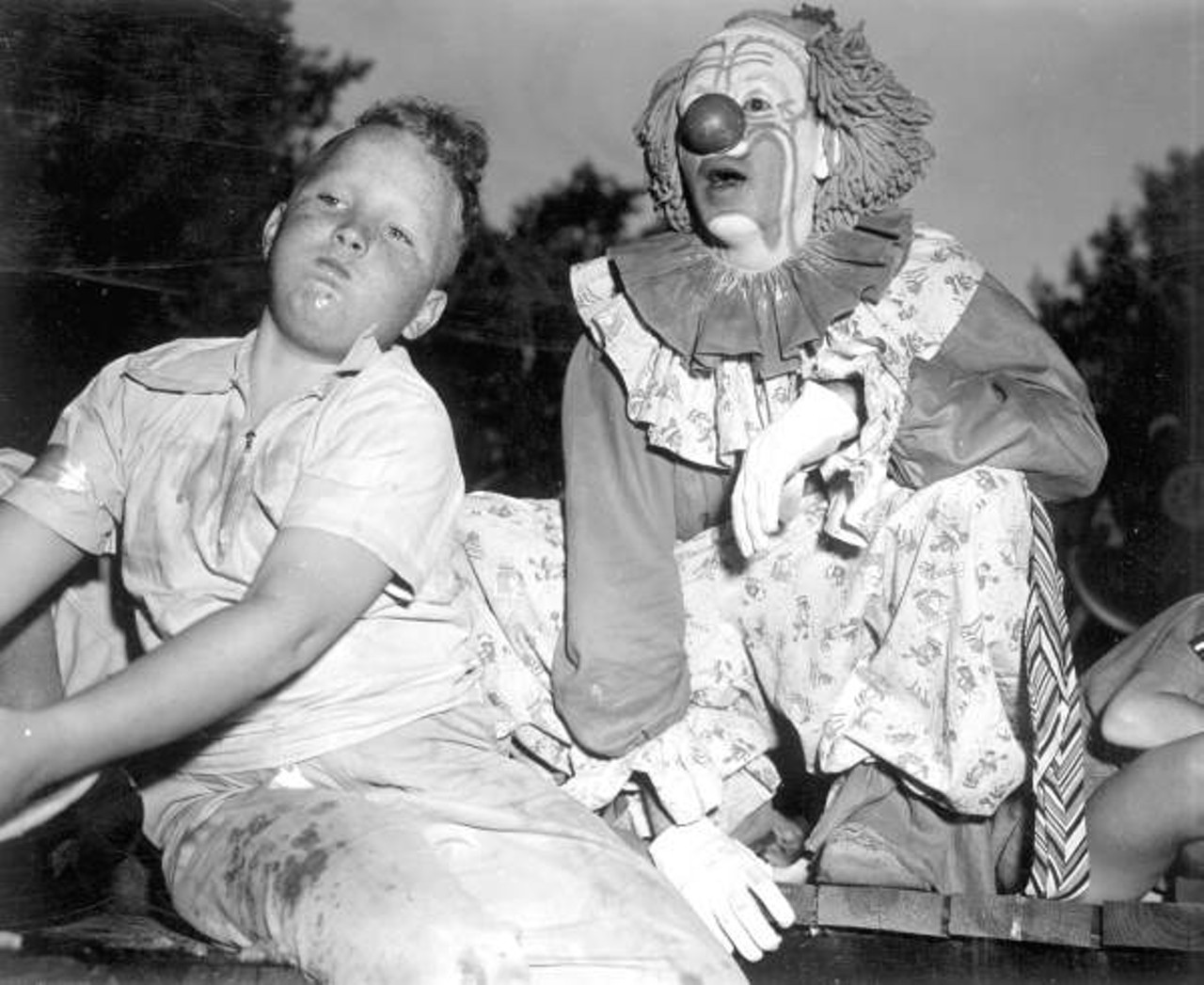 A boy and a clown at a watermelon-eating contest in Leesburg circa 1951 (via floridamemory.com)