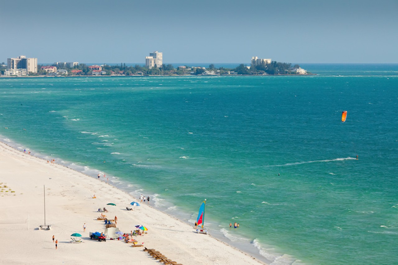 Lido Key
Estimated driving distance from Orlando: 2 hours and 45 minutes 
A seasonal nightclub scene and woodland trails bring many to Lido Key, located near Sarasota. Lido Key is known as a more relaxing alternative to the sometimes rowdy Siesta Key, but alcohol is allowed as long as the bottles are left at home, and the scenery makes for a popular wedding destination. 
Photo via Adobe