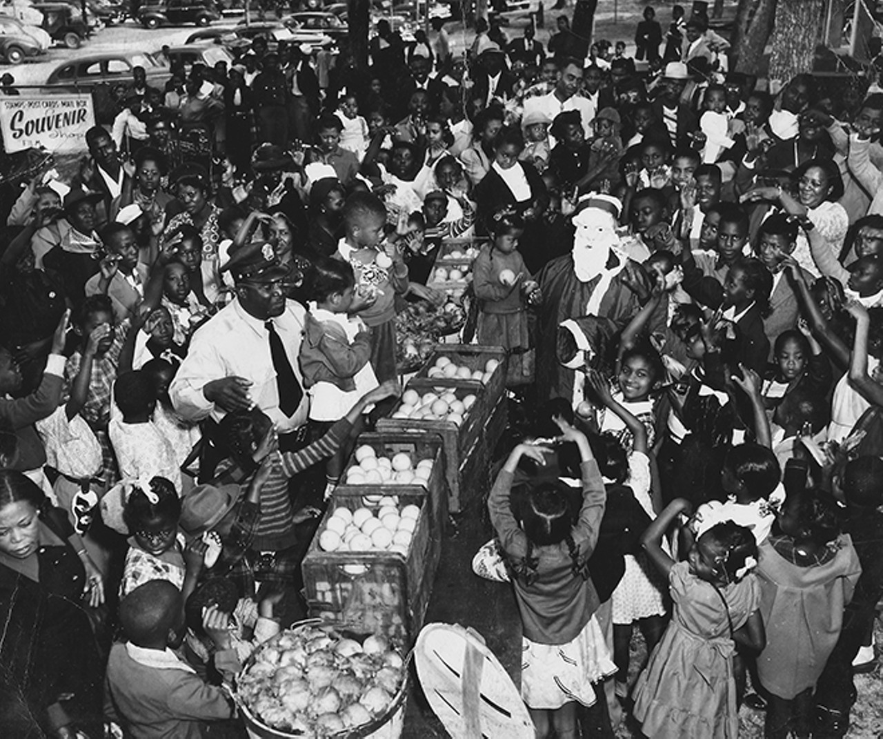 The Christmas holiday season was a time when many families gathered at Paradise Park. Often the park staff would distribute oranges to the families. Photo by Bruce Mozert. By permission of Bruce Mozert. Courtesy of the Marion County Black Archives. Reprinted with permission of the University Press of Florida.