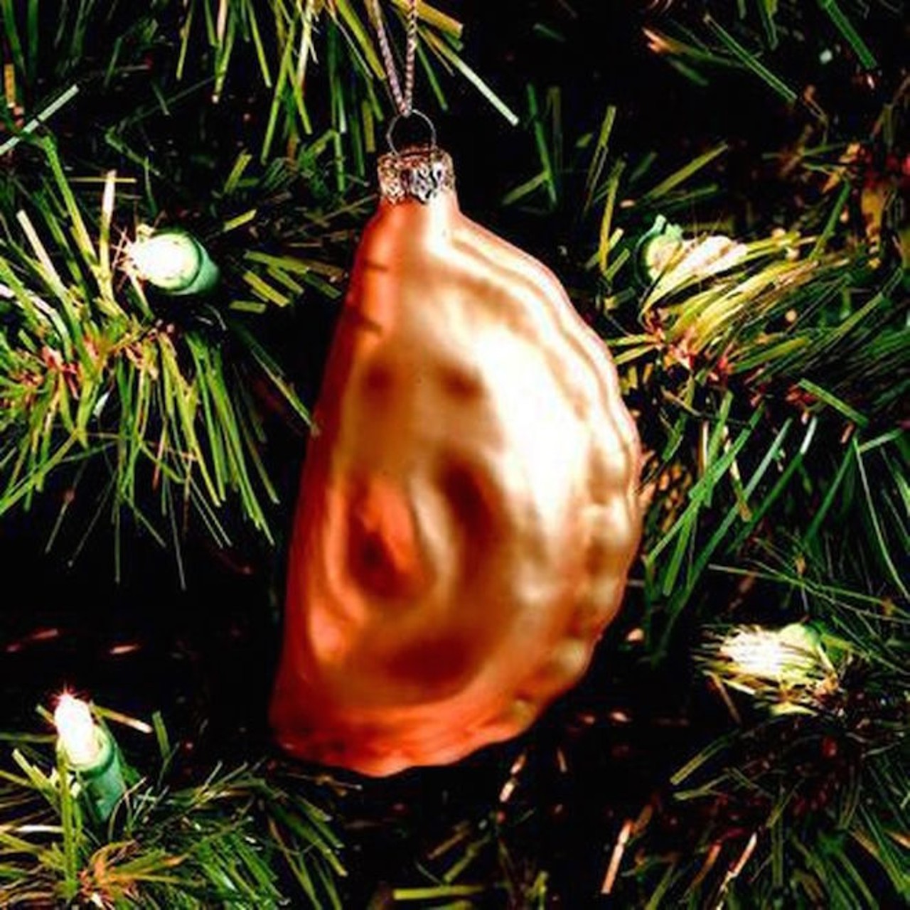 A Christmas tree ornament shaped like a pierogi.
