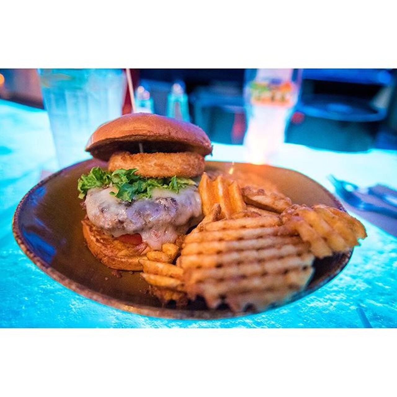 Sandwich and waffle fries at Disney Spring's T-REX Restaurant.
Photo via @brandon_blogs