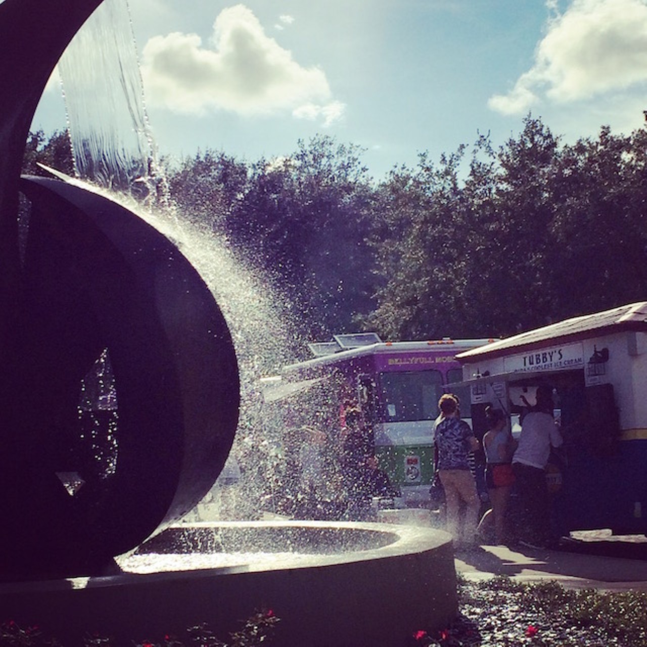 Artlandi: a view of Tubby's Ice Cream Truck through the fountain at OMA