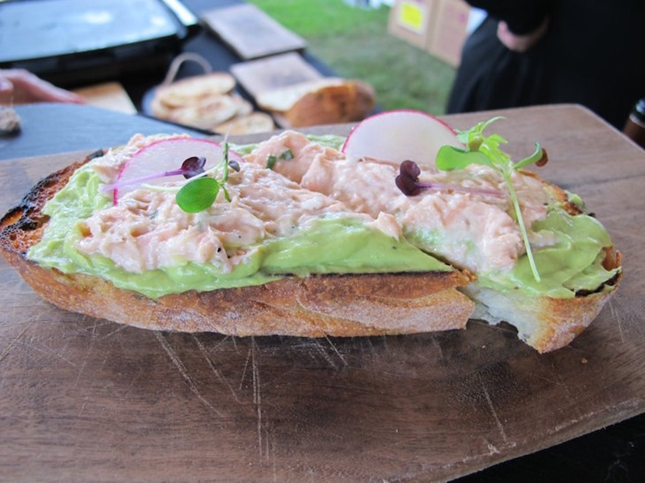 Salmon toast with avocado mousse on grilled potato-chive bread with pickled mustard seeds (Slate)