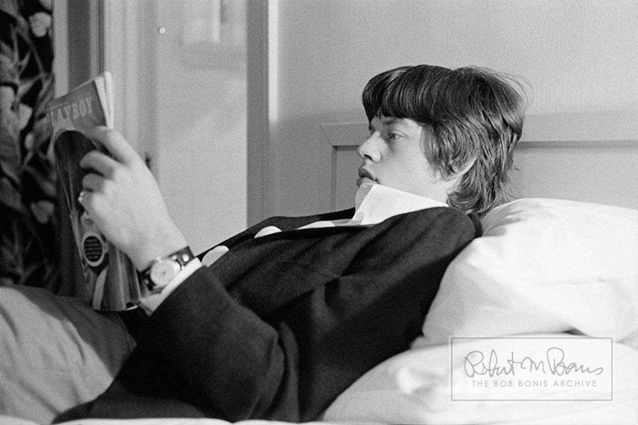 Mick Jagger Reading Playboy Magazine, Los Angeles, California, May 1965 #1 Life on the road can get lonely and even a bit mundane after the high of a live performance. In the spring of 1965, the Rolling Stones stayed in L.A. for several concert performances, TV appearances (including Hollywood A Go Go and Shindig), and recording sessions at RCA Studios. Here Mick Jagger takes advantage of a little downtime to catch up on the June 1965 issue of Playboy magazine, perhaps reviewing the first ever nude pictorial spread of James Bond Girl Ursula Andress.  Four years later, Mick went from fanboy to main man when he was profiled in the November 1969 issue. The Stones would later stay in the Playboy Mansion in Chicago &#150; at Hugh Hefner&#146;s personal invitation &#150; because hotel rooms were scarce during their 1972 US tour (an invite Hefner likely regretted after Keith Richards and Bobby Keys accidentally set fire to one of his bathrooms). And in perhaps the strangest twist, 46 years to the month after reading this very issue of Playboy, Mick&#146;s daughter Lizzy would bare all for the June 2011 issue.