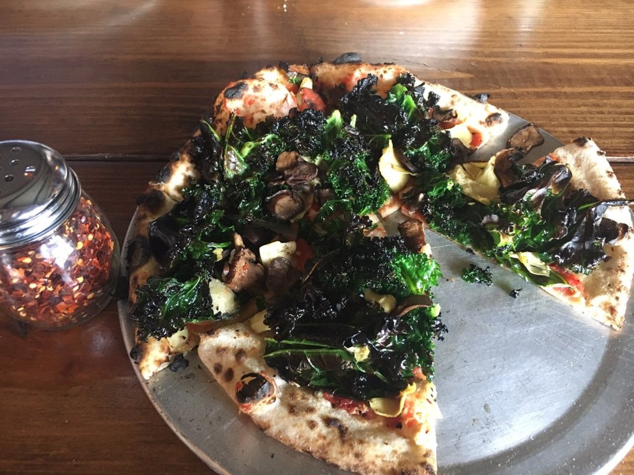 Pizza Bruno
3990 Curry Ford Road
Did you know Bruno's pizza dough is vegan? There are two vegan pies on the menu, the classic marinara with basil and sliced garli, and the Viva Verde, topped with a whole lotta veg. 
Photo via Yelp user Lisha Y.