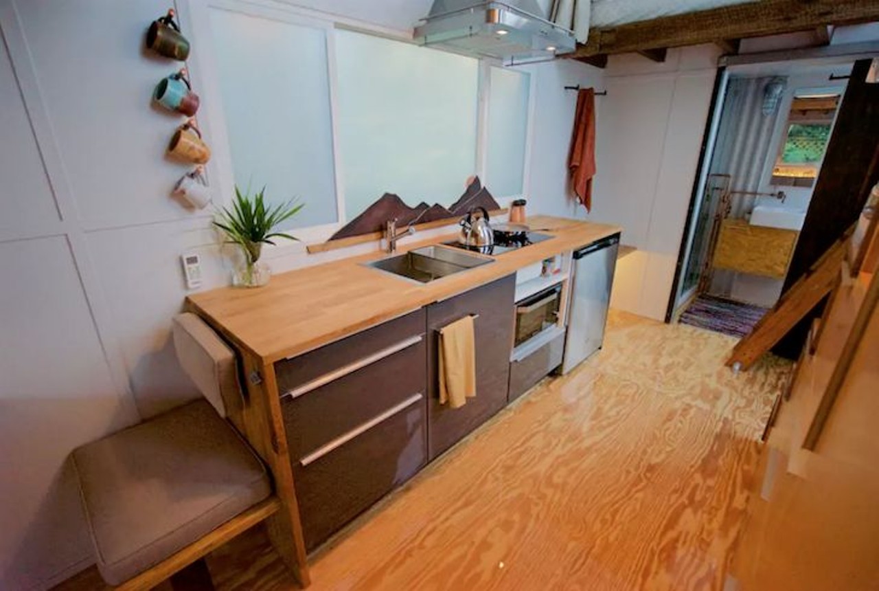 "Tiny House Experience" | Tampa
2 beds, 2 baths
$79/night
The full size kitchen features a 2-burner cooktop, oven, microwave and fridge.