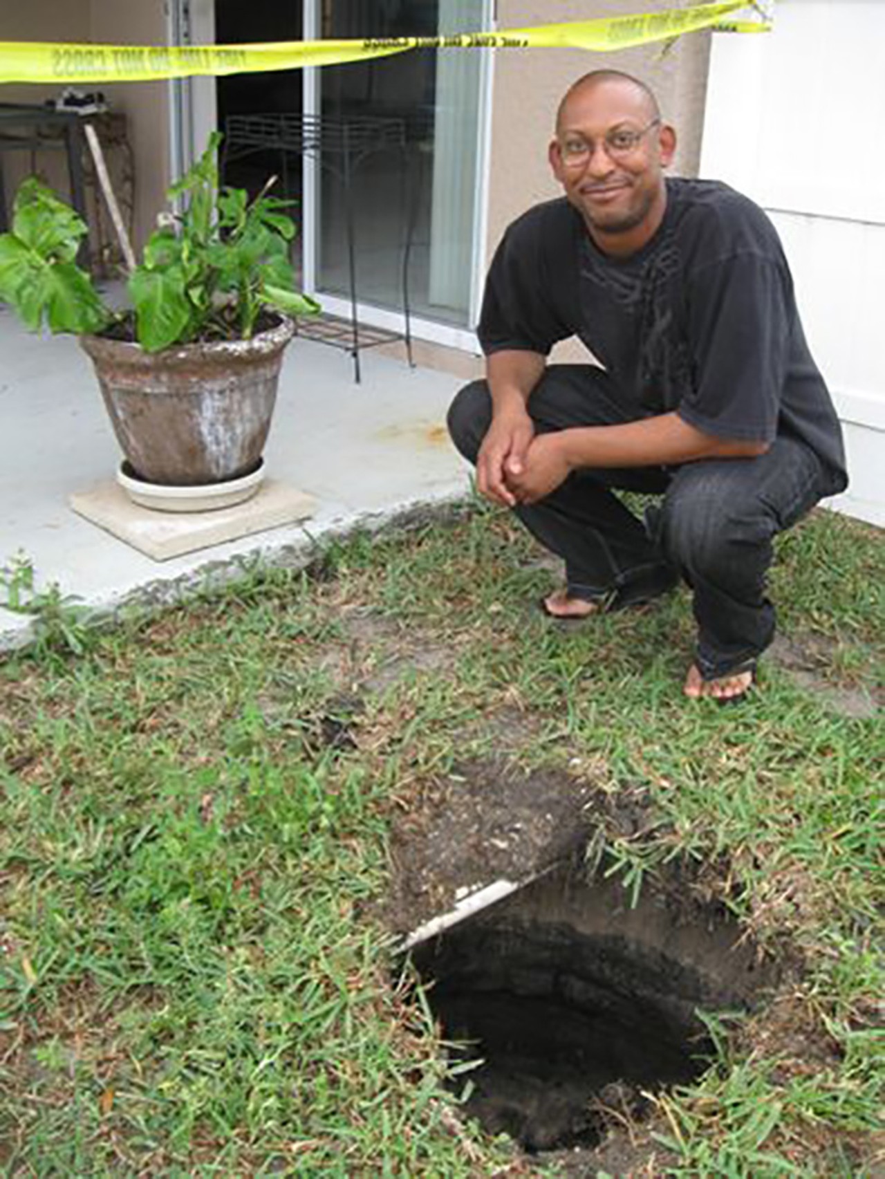 Woman trapped in backyard sinkhole twice
March 29, 2011
Carla Chapman of Plant City, Fla. was trapped inside a sinkhole in her backyard for two hours until a neighbor came to the rescue. Then, a year later, another narrow sinkhole opened up in her backyard that gobbled her up. Chapman called her husband who then contacted emergency services. Police and firefighters managed to drag her out of the hole. We don't blame her if she never wants to go back out there.
Photo via tampabay.com