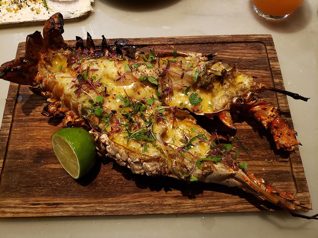 
Key West spiny lobster, Luke's Kitchen and Bar
When chef Jason Campbell announced on Instagram the arrival of these spiky buggers, I made a beeline to Luke's in Maitland. The lobster, jerk-rubbed with Florida datil peppers then fire-grilled over Florida white oak before being glossed in a citrus beurre mont&eacute;, comprised a hidden additive: that secret ingredient that allows you to block out the world.
