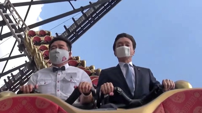 Two executives from the Fuji-Q Highland amusement park silently ride the the Fujiyama coaster