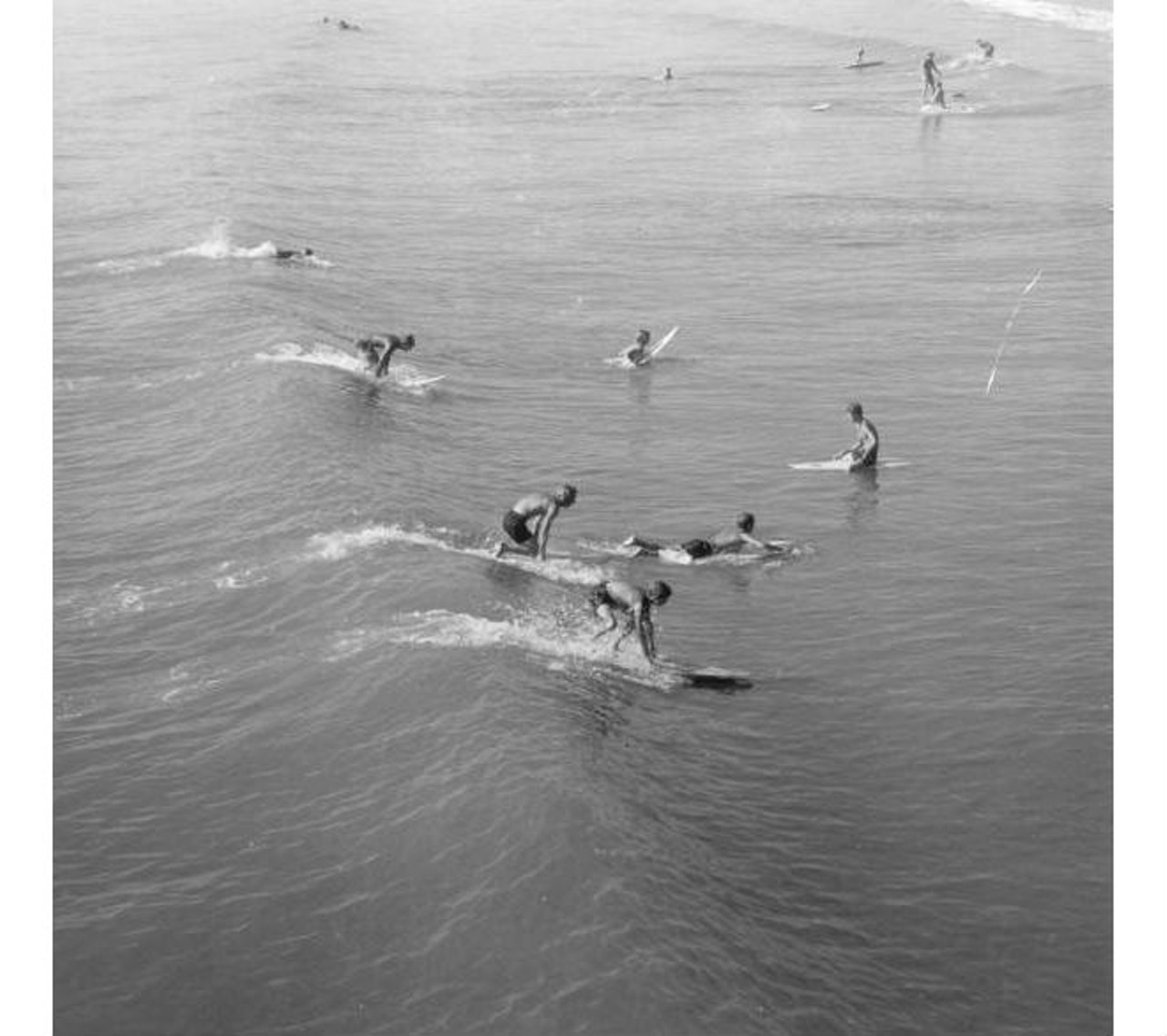 Surfers at the beach, 1970