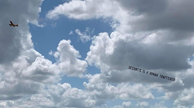 Plane carrying 'DeSantis is a human trafficker' banner flies over Orlando following migrant stunt