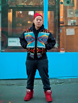 Eddie Huang in front of his New York restaurant - PHOTO BY ATISHA PAULSON