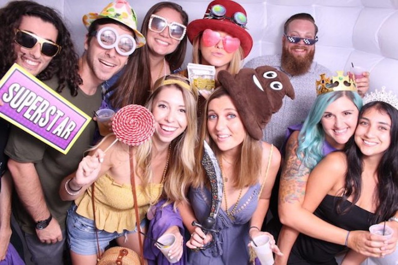 Everyone's glowing faces from the Universal Roofing / Renewal By Andersen Glow Photo Booth by Uptown Selfie at Best of Orlando 2019!