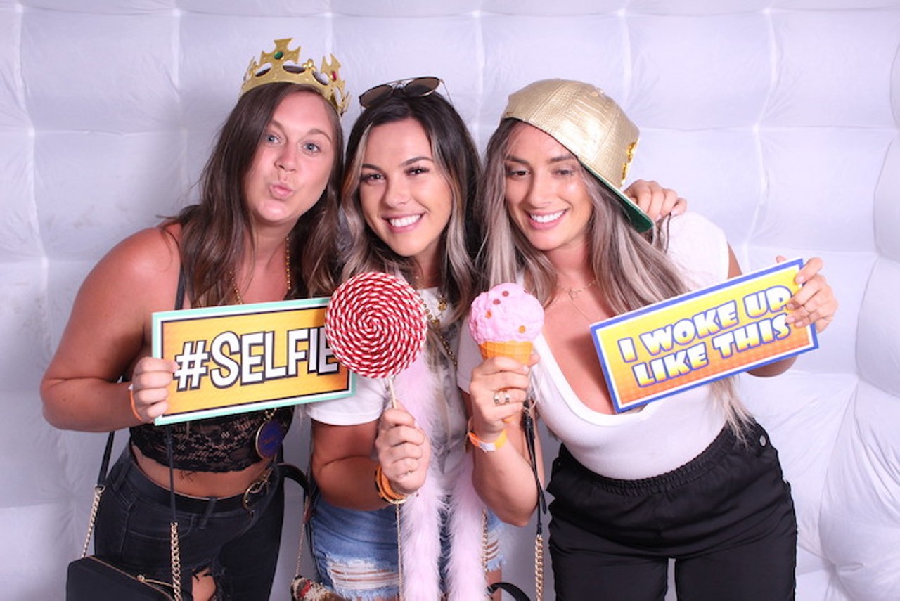 Everyone's glowing faces from the Universal Roofing / Renewal By Andersen Glow Photo Booth by Uptown Selfie at Best of Orlando 2019!