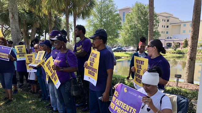 Employees of HCA Florida Osceola Hospital rally outside the hospital over understaffing, which they say is creating unsafe conditions for patients (May 10, 2023)
