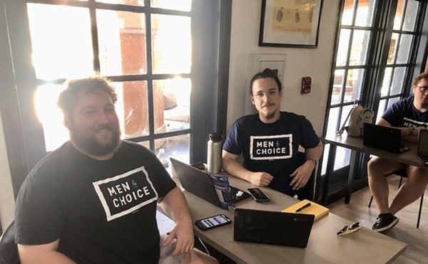 Florida men make calls for Florida's Amendment 4 as part of a joint effort by Mi Vecino and Men 4 Choice to get out the vote.