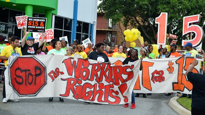 Workers at a Fight for 15 rally in Orlando.