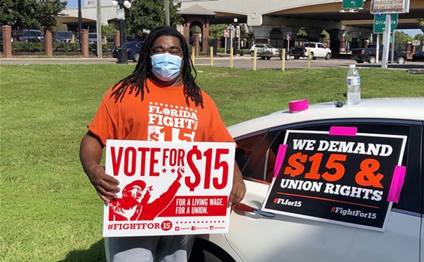 Florida workers organized with Fight for $15 rallies in support of a $15 minimum wage outside a McDonald's in Tampa, Florida in August 2020.