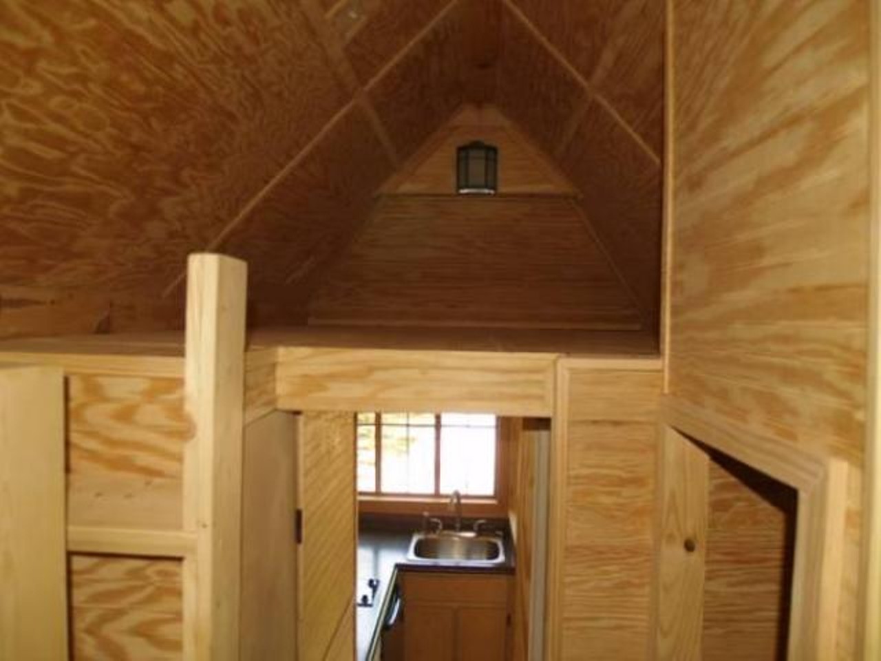 Tumbleweed Cypress 20
Price: $44000
Size: 144 sq ft 
There's enough room up there for a bed tent!