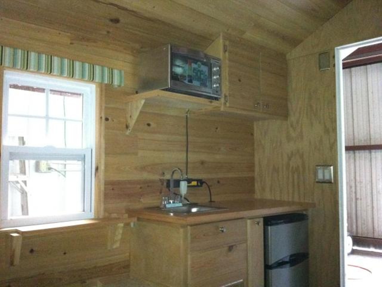 Aqua Tiny House
Location: Eustis
Price: $15000
Size: 70 sq ft
The full kitchen has everything you need.