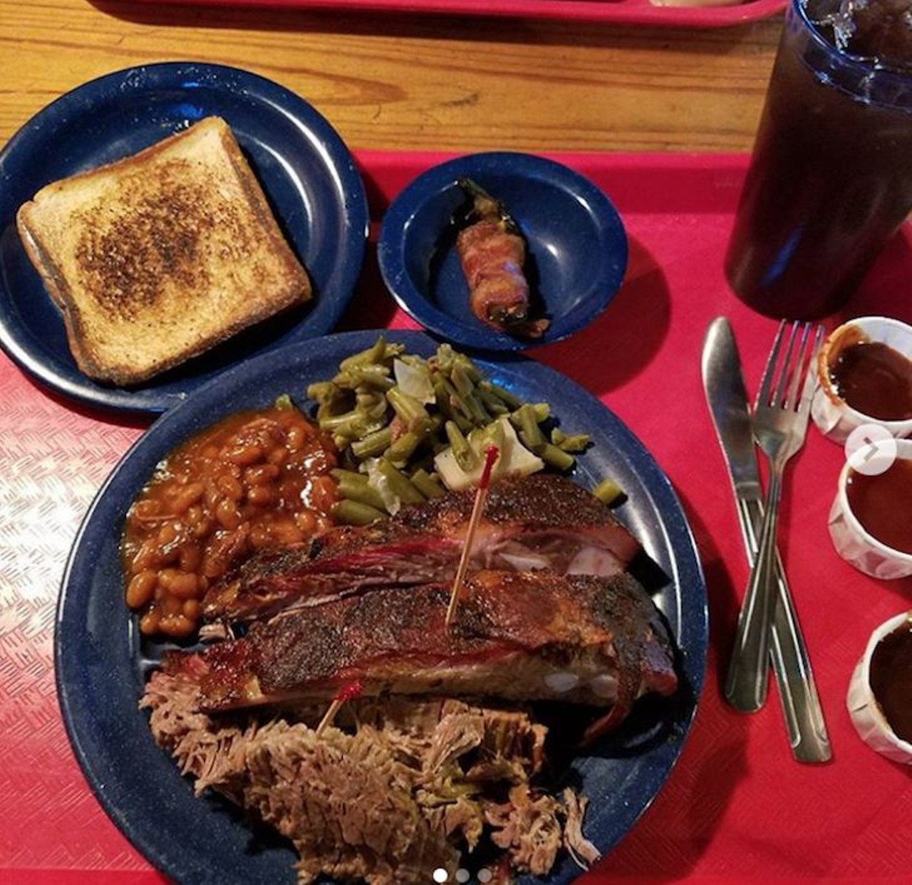 Try this: Ribs, brisket, baked beans, green beans, Texas toast, jalapeno popper. That&#146;s one heavy tray. When you get to scoop your own sides, things can get out of hand quickly.
Photo via trickydicky71