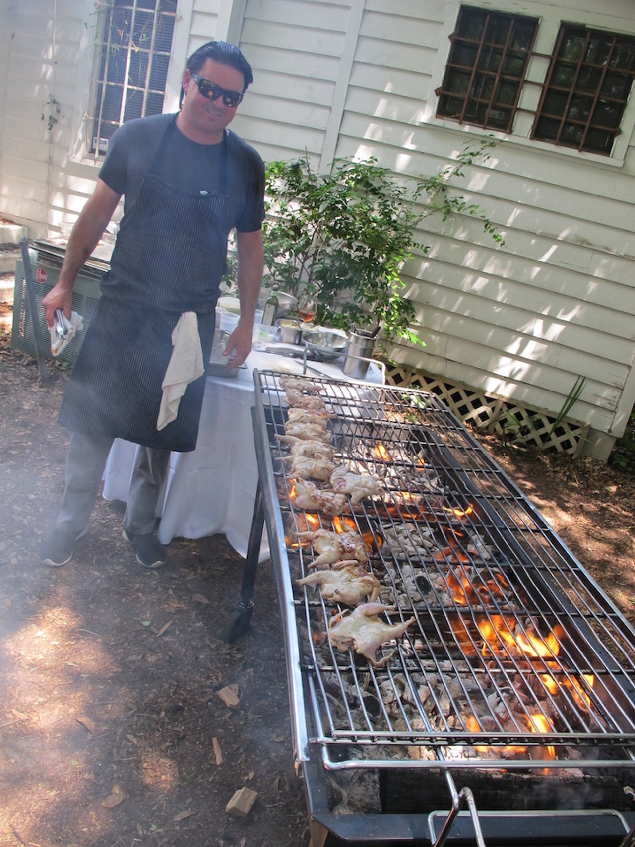 James Petrakis overseeing grilled quail