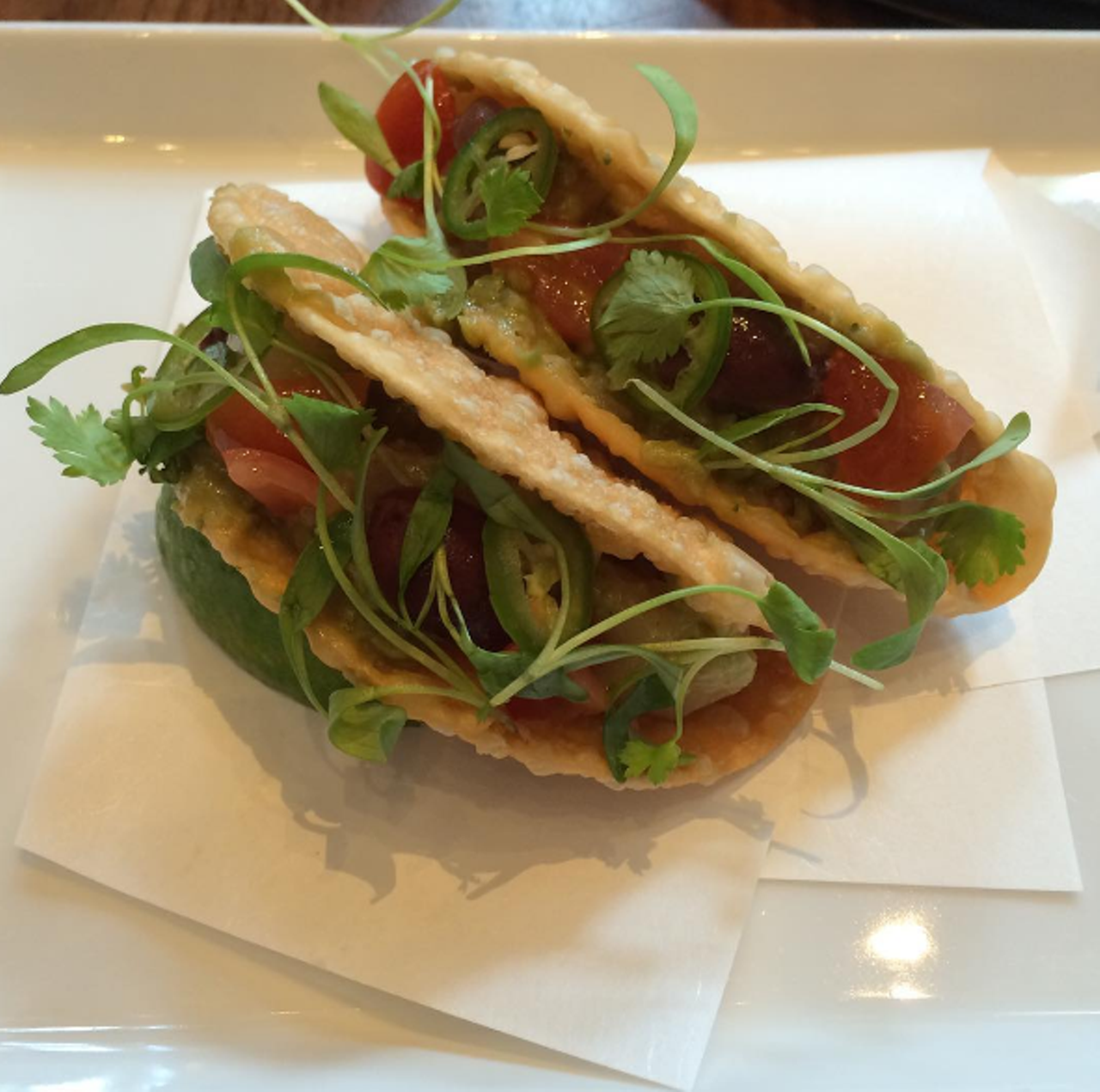 Hamachi tacos at Morimoto Asia
1600 Buena Vista Drive, 407-939-6686
Sushi-grade yellowtail served in fried gyoza wrappers (so cute!) and topped with cilantro, guacamole, olives and jalape&ntilde;o.
Photo via patriciasari/Instagram