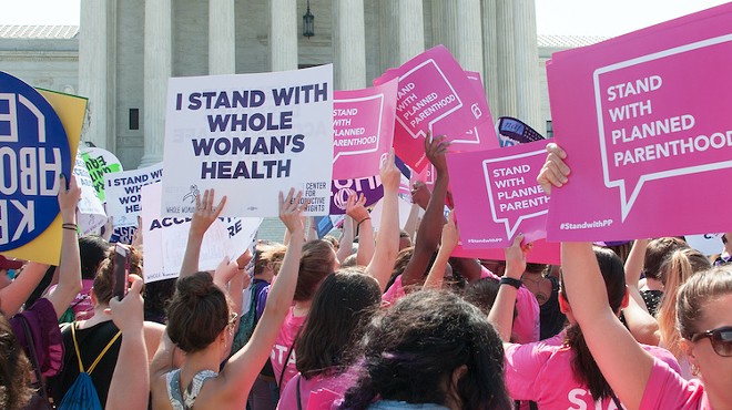 Pro-choice activists await the SCOTUS ruling on abortion access in front of the Supreme Court in Washington, D.C.