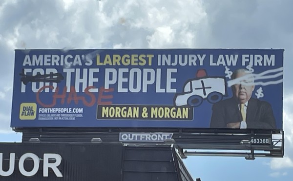 A 'vandalized' Morgan & Morgan billboard advertisement spotted in Orlando, Florida. Aug. 2023.