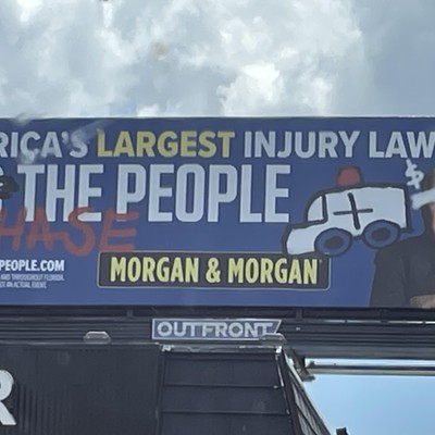 A 'vandalized' Morgan & Morgan billboard advertisement spotted in Orlando, Florida. Aug. 2023.