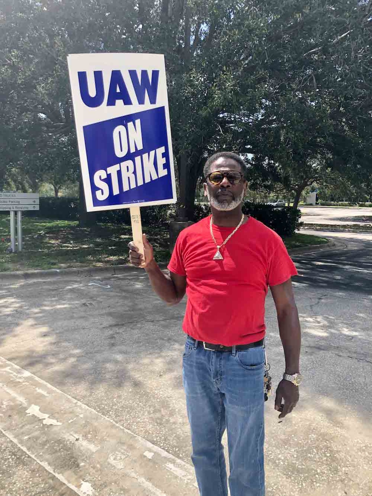 Tovic Powell, Vice President of UAW Local 1649, strikes alongside his coworkers and union members at a Stellantis/Chrysler parts depot in Orlando on Sept. 22, 2023.
