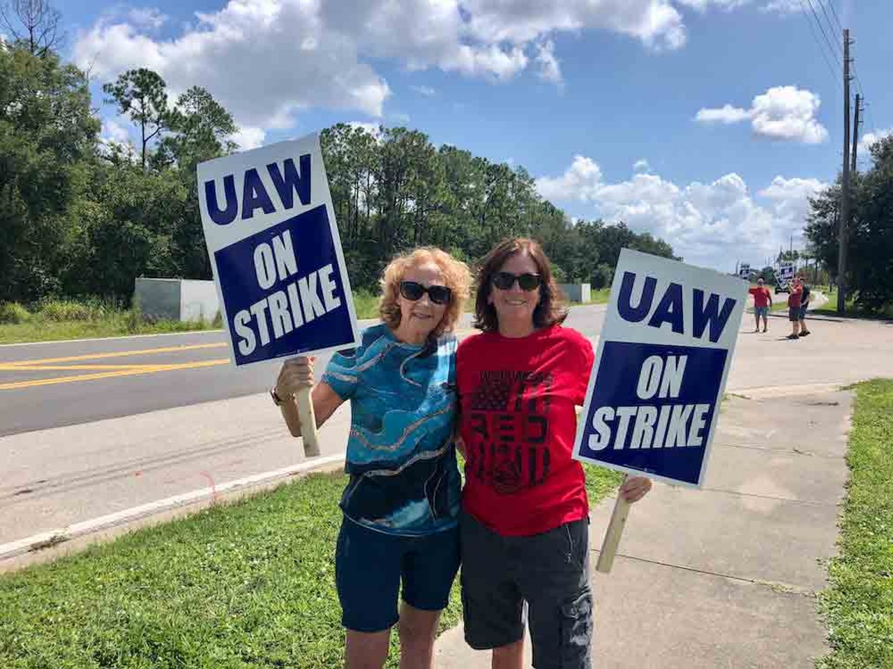 Wanda Carithers (left) and Gale Carson (right) join a strike outside of a Chrysler/Stellantis parts depot in Orlando, Florida with their coworkers and union members on Sept. 22, 2023.