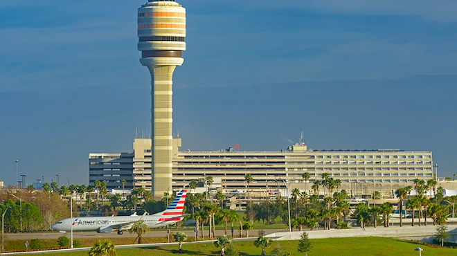 A view of MCO including the air traffic control tower and the monorail.