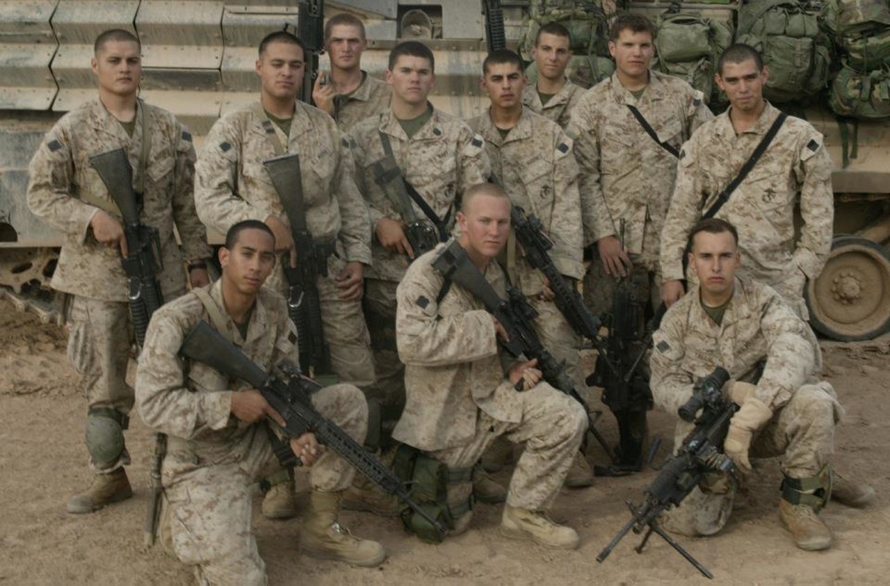 Marines from Fred's squad pose for a traditional unit photo. In hours they would begin the assault of Fallujah under cover of darkness.