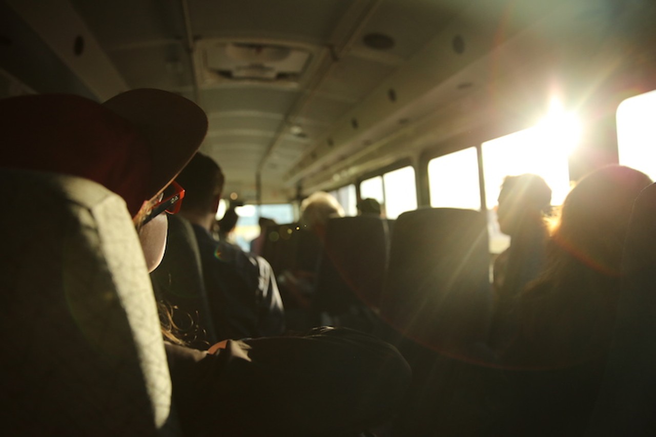 Media members on the press bus