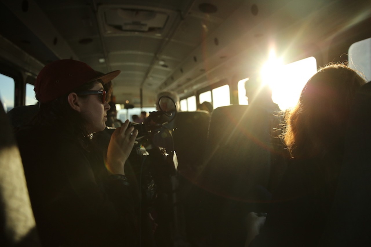 Media members on the press bus